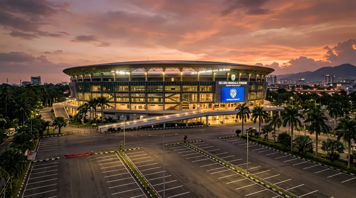 Stadion sepak bola dengan suasana malam hari yang megah menggambarkan besarnya industri transfer pemain